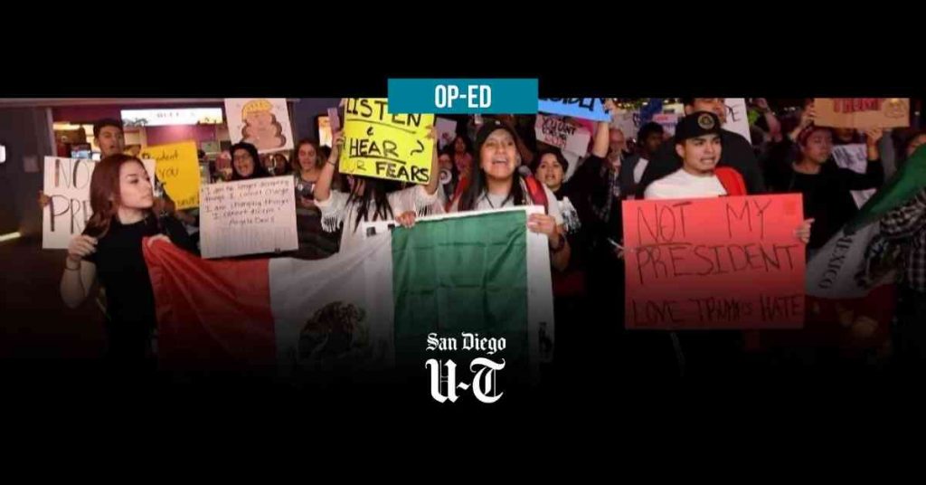 Protesters holding up the mexican flag